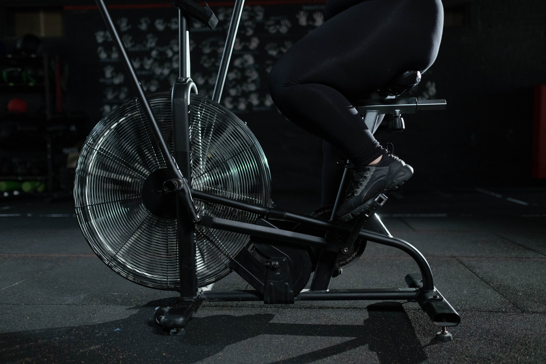Person in Black Pants Using a Stationary Bicycle